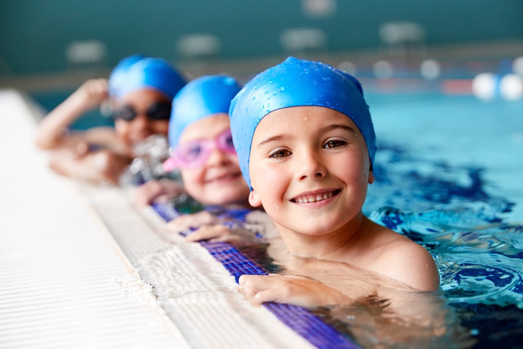 Children in Water at Edge of Pool 